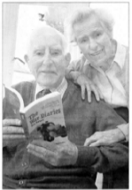 RIGHT - Ray Davey with wife Kathleen looking at his book the War Diaries. US42-134AO Picture By: Aidan O'Reillly