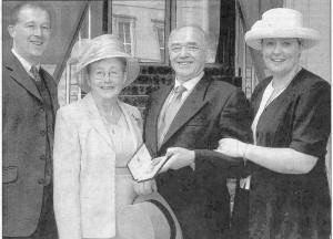 Jim Dillon with his family at Buckingham Palace