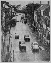 Although blasted by bombs. on several occasions,, Bow Street in Lisburn is still very much in business and will be a lively scene when the Mayor's Show parades through it next Saturday.