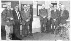 Pictured at the installing of the Lisburn Newsroom centenary scroll in the local museum are Mr. Ernest Bell, Mr. Hamilton Hewitt, Mr. J. H. F. McCarrison, the last President, Mr. James Johnston, Mr. Joseph Palmer, Mr. Howard Stevenson, Mr. Garfield Hutchinson, Mr. TrevorNeill, of Lisburn Historical Society and Mr. George Anderson. E4904.