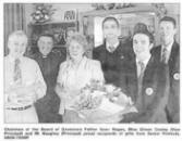 Chairman of the board of Govenors Father Sean Rogan, Miss Eileen Cooley (Vice Principal) and Mr. Haughey (Principal) proud reipients of gifts from Senior Prefects. US26-753SP