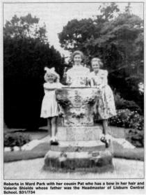 Roberta in Ward Park with her cousin Pat who has a bow in her hair and Valerie Sheilds whose father was the Headmaster of LisburnCentral School S31/734