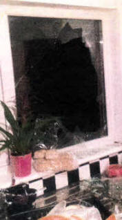 A broken window at their home