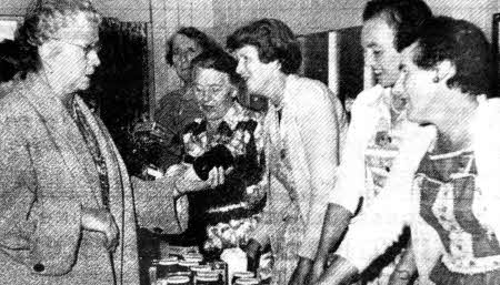 The ladies branch of Lisburn Golf Club held a coffee party and bring and buy sale in September 1958. Pictured is the Lady Captain Mrs. RN Stevenson buying jam