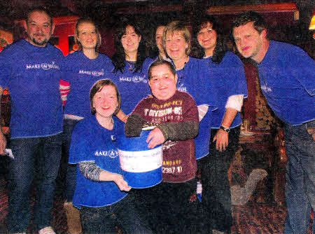 Making the draw are from left to right: Paul Best, Julie McCulllagh, Krissie Hammond, Louise Hull, Susan McCullagh, Carrie Whylie, David Bell, in front Lucinda White and Joshua Fletcher.