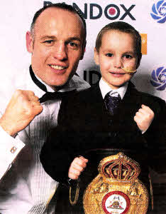 World champion boxer Brian Magee with little Patrick Campbell.