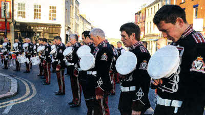 Members of Pride of Knockmore Flute Band lay a wreath at the UDR memorial at Market Square. US2012.504cd