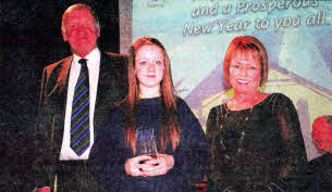 Vice Chair of the Board of Governors John Tomelty and Principal Imelda Jordan with Martha Anne McCashin who received the award for attendance