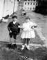 The baby is my eldest daughter Julie, the boy my cousin Paul Watters, the girl holding the baby is Angela Watters , daughter of my Aunt Muriel Bradley from Linenhall St, the other girl on the tricycle in the background is another daughter Rosemary. It was taken in spring / summer 1966. Donald