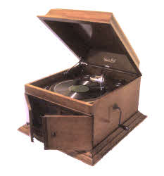 Edison Bell table model gramophone of circa late 1920s. This is pretty much the type of gramophone that many homes would have owned at the time these record sleeves were printed ( you can see one of a similar type at the bottom right of the J.C. Patterson sleeve ). Edison Bell table model gramophone of circa late 1920s. This is pretty much the type of gramophone that many homes would have owned at the time these record sleeves were printed ( you can see one of a similar type at the bottom right of the J.C. Patterson sleeve )