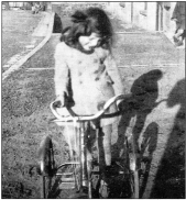 Adrienne Carson (nee Kennedy) playing in Bridge Street, Hilden in 1942. US19-728SP