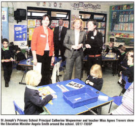 St Joseph's Primary School Principal Catherine Wegwermer and teacher Miss Agnes Travers show the Education Minister Angela Smith around the school. US17-733SP