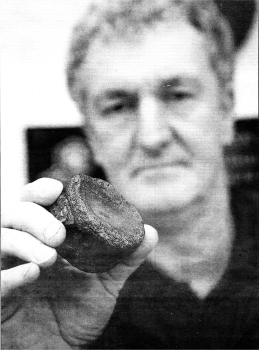 Education Ranger Paul Bennett with the fossil believed to be about 200 million years old-found on the banks of the Colin River.