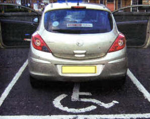 lt is clearly impossible to manoeuvre a disabled person into a wheelchair in the parking bays without using some of the space next to it.