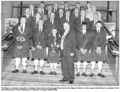 The Mayor of Lisburn, Councillor Jonathon Craig hosts the Drumlough Pipe band at the Mayor's Parlour in the Lagan Valley Island to celebrate them becoming Grade 4 World Champions in Glasgow in August ÚS39-450CL