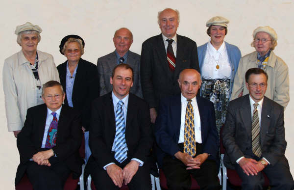 Lisburn Christian Workers’ Union Committee.  L to R: (seated) Joseph Lockhart (Secretary), Rev Albert Griffith (Honorary Vice President), David Seeds (Chairman) and Robert Watson (Assistant Secretary).  (back row) Jean Kennedy, Mary Moore, Robert Moore (President), Michael McNeilly, Margaret Sharkey and Joyce Healy (Treasurer). Missing from the photo are Hazel Borland and Isobel McComb