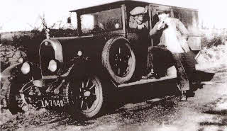 Davy Jones, in the 1920’s Morris Cowley van used for the milk rounds. Harry Mulholland is standing to the right of the picture. The vehicle had a starting handle and bears the registration number IA 7440 indicating it was registered pre March 1932.