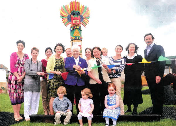 Staff, parents and future pupils gather at the official opening of Rowandale Community Playgroup. Performing the honours were Baroness May Blood (centre, L) and Marie Cowan (centre R) of the Integrated Education Fund which awarded a grant to support the new facility. The preschool playgroup, which is in Moira, is now taking applications for places in September. Pic by Declan Roughan.